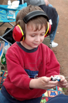 This year's picture of Parker enjoying time at our local dirt track, East Lincoln Speedway, Stanly, NC. Parker puts his phones as soon as we get out of the car in the parking lot, and wears them for several hours at a time. He loves them.
